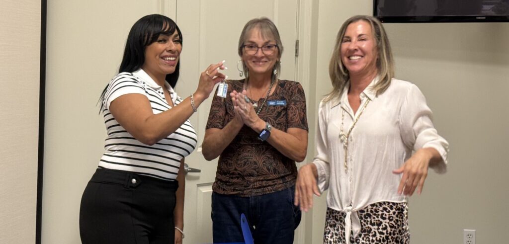 Alexander Avenue Closing Day 5 Betzaida receives keys (4) August 29 Alexander Ave Closings