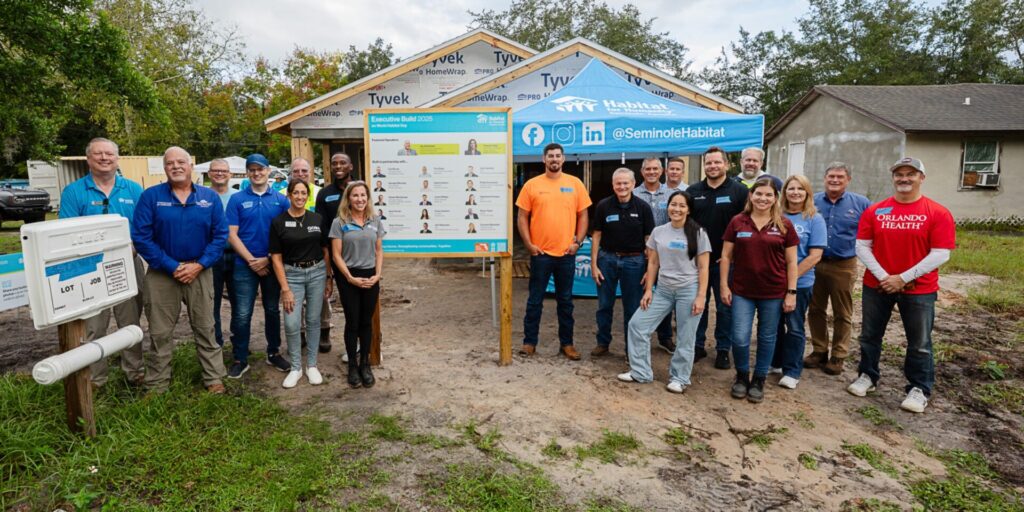Executive Build 2025 Group Picture in Front of Habitat Home