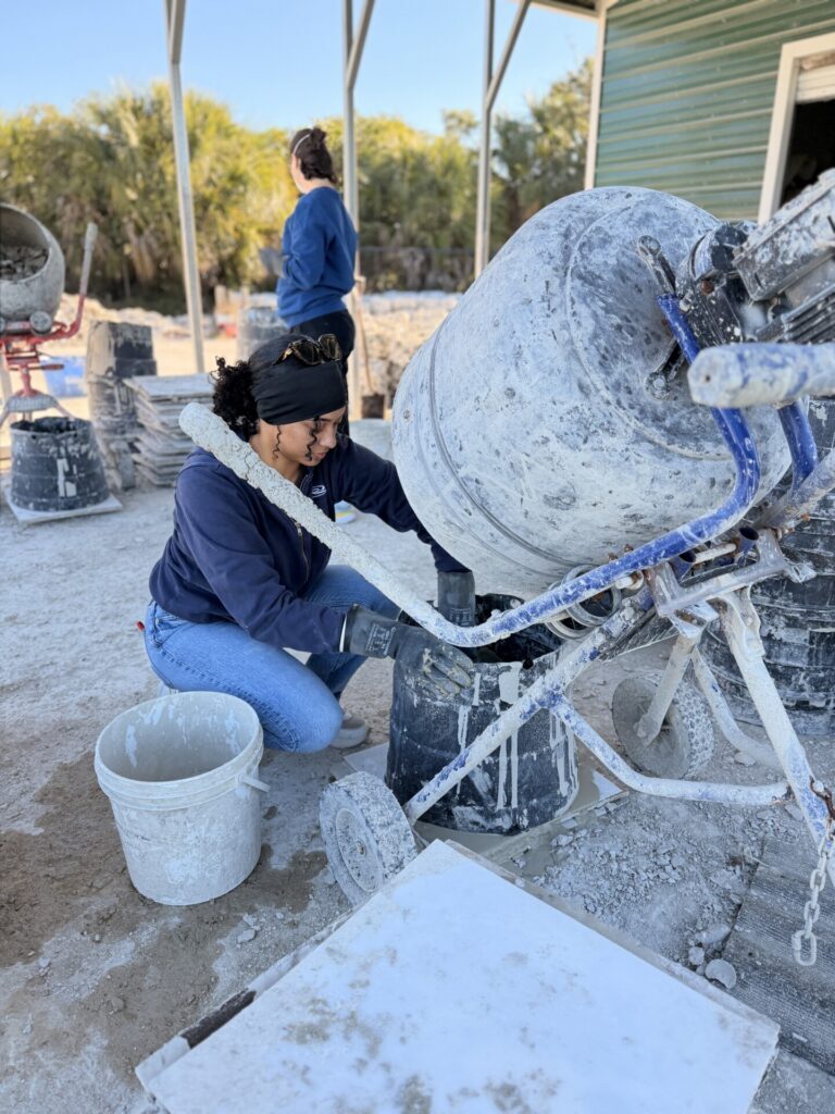 Madilynn pouring shell mix into mold